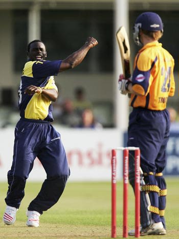 Carl Greenidge celebrates after trapping Jim Troughton lbw