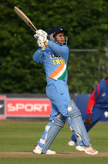 Parvez Aziz smacks one back past the bowler