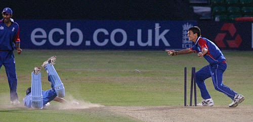 Down to the wire ... Karan Singh's despairing dive is in vain as Steven Finn removes the bails