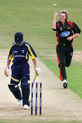 Nick Walker celebrates the wicket of Gerard Brophy