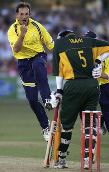 Deon Kruis celebrates the wicket of Ronnie Irani