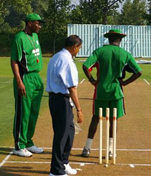 Roger Harper looking at the pitch