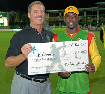 Man of the Match Esuan Crandon collects his $25,000 cheque from Allen Stanford