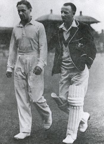 Gubby Allen and Don Bradman return to the pavilion during a rain delay