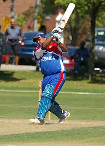 Clay Smith hits one past the bowler