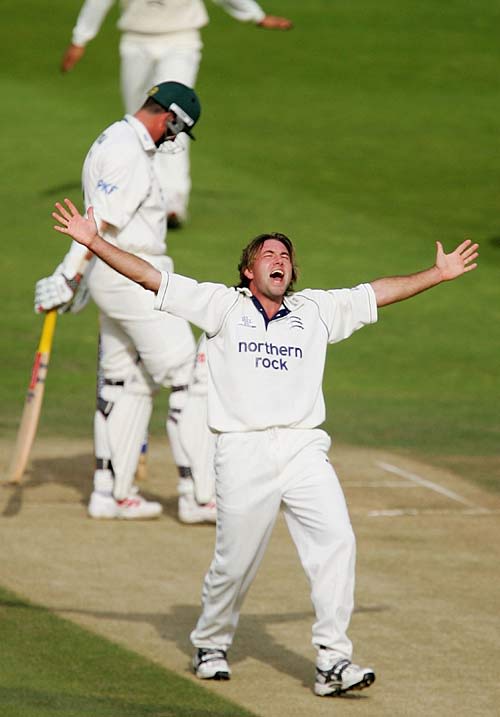 Chris Silverwood celebrates the wicket of Darren Bicknell