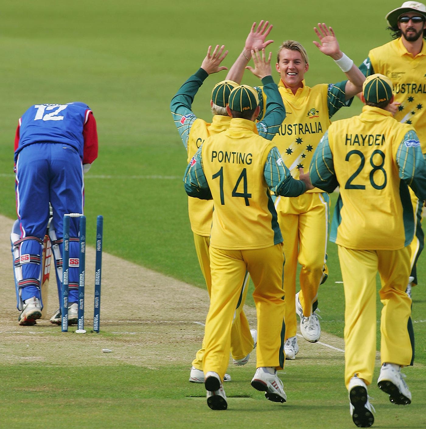 Brett Lee is congratulated after bowling Mark Johnson second ball