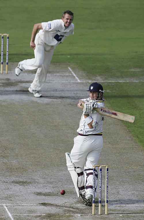Gary Scott pulls a ball from Dominic Cork