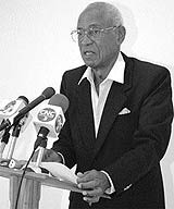 Ken Gordon addresses a media gathering