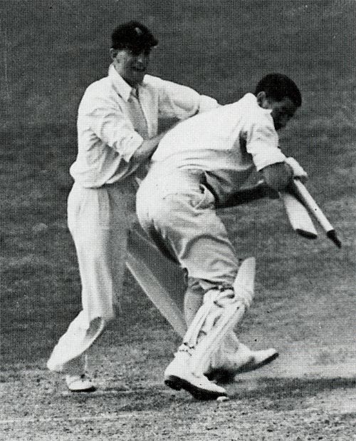 Len Hutton good-naturedly scraps with Chuck Fleetwood-Smith for a souvenir