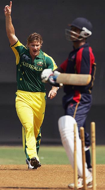 Shane Watson celebrates bowling the MCA XI's Nishit Shetty