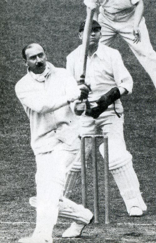 Percy Fender lofts a six in a Surrey trial game