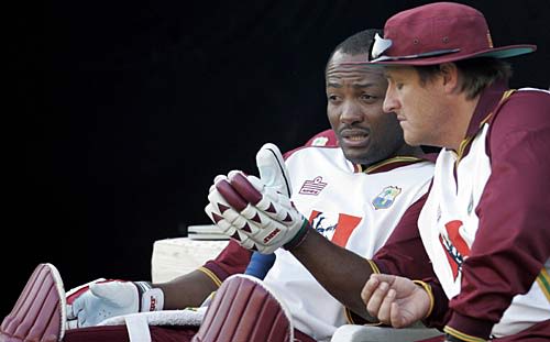 Brian Lara chats with his coach Bennett King