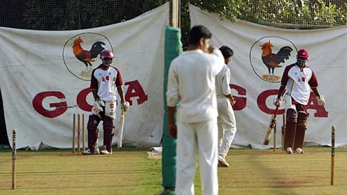 Dwayne Smith and Wavell Hinds wait for their next deliveries in the nets
