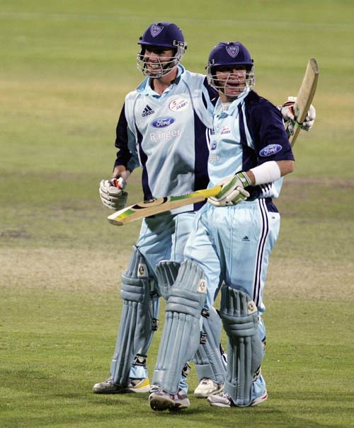 Brad Haddin and Aaron Bird celebrate victory