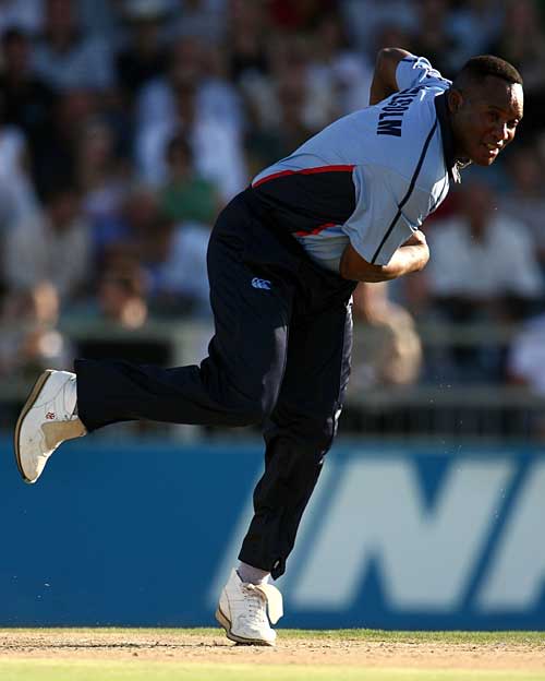 Devon Malcolm roars in to bowl