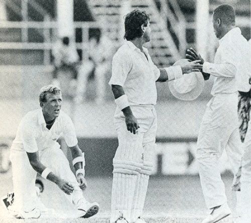 Allan Lamb steps between a rowing Alec Stewart and Desmond Haynes