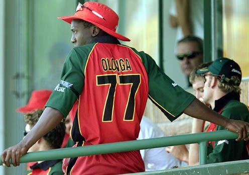 Henry Olonga wears a black armband in protest while in the players' enclosure