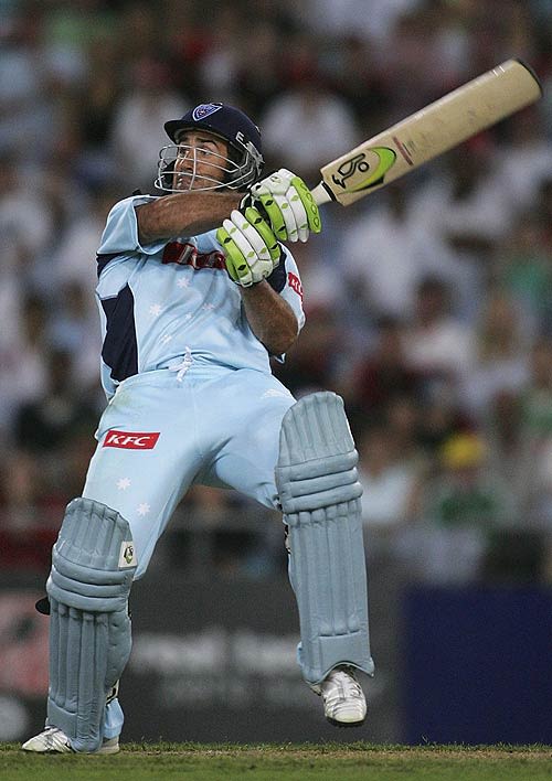Andrew Johns swats a ball over the slips