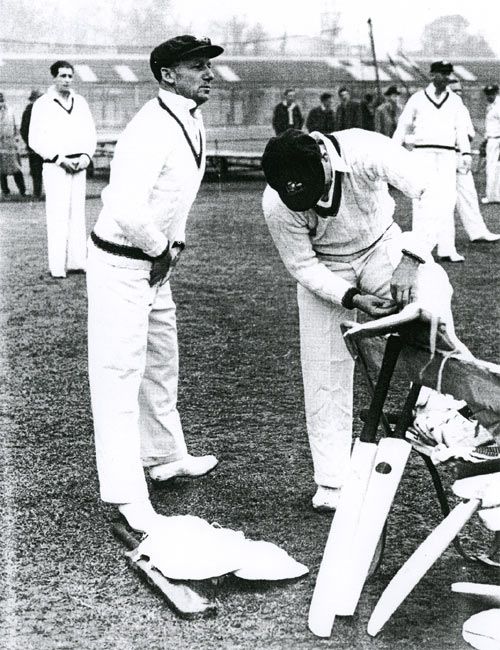 Don Bradman, 'box' in position, prepares to tune up in the nets