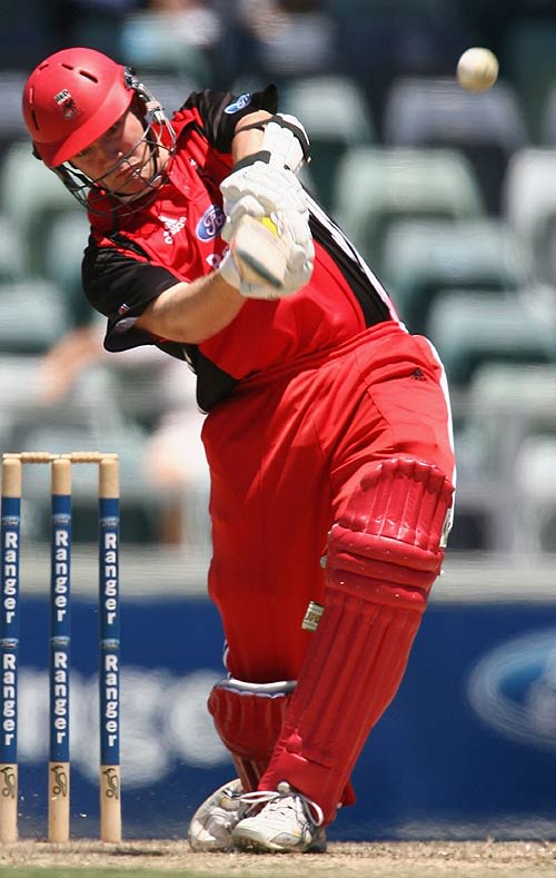 Nathan Adcock hits over the infield during his innings of 90