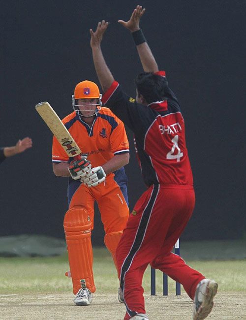Darron Reekers survives an appeal from Umar Bhatti