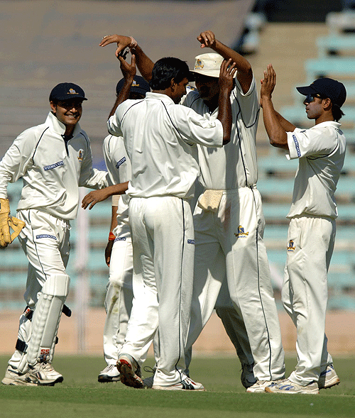 Saurasish Lahiri gets the high-fives after dismissing Sachin Tendulkar