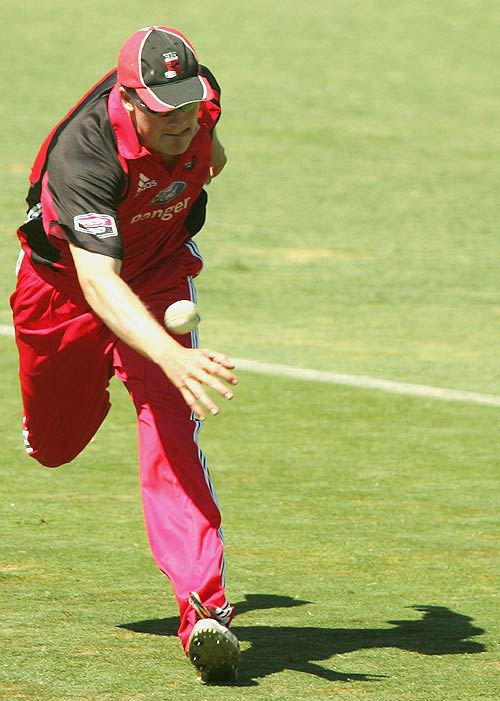 Nathan Adcock spills a catch