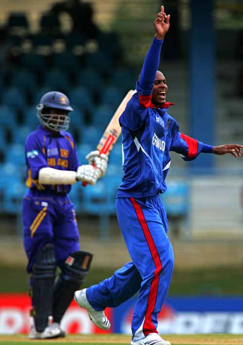 Kevin Hurdle strangles Upul Tharanga down the leg side and picks up his wicket