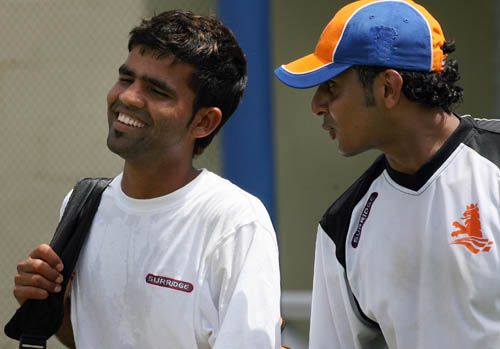Mohammad Kashif and Adeel Raja walk in to practice at Warner Park