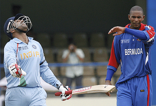 Virender Sehwag reacts after being dismissed at 114 by Kevin Hurdle