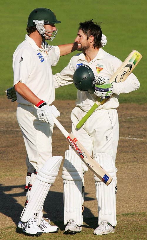 Adam Griffith congratulates Sean Clingeleffer on his century