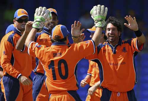Billy Stelling runs to his captain of the day, Jeroen Smits, after picking up a wicket