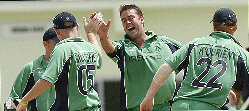 Dave Langford-Smith is congratulated by team-mates after dismissing Scott Styris