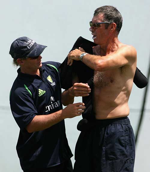 John Buchanan gets some treatment from the Aussie physio