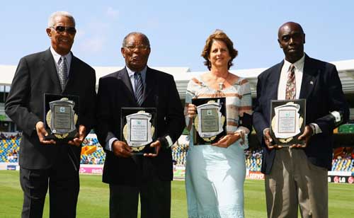 Sir Garfield Sobers, Sir Everton Weekes, Kathryn Ward (for her father Denis Atkinson) and Denis Depeiaza (for his father Clairmonte Depeiaza) receive awards as West Indies cricket record holders