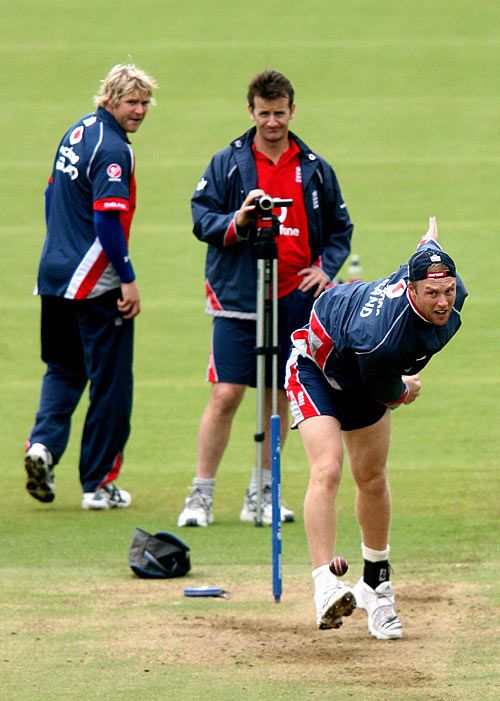 Andrew Flintoff tests out his ankle in a practice session at Lord's, watched by Kevin Shine and Matthew Hoggard