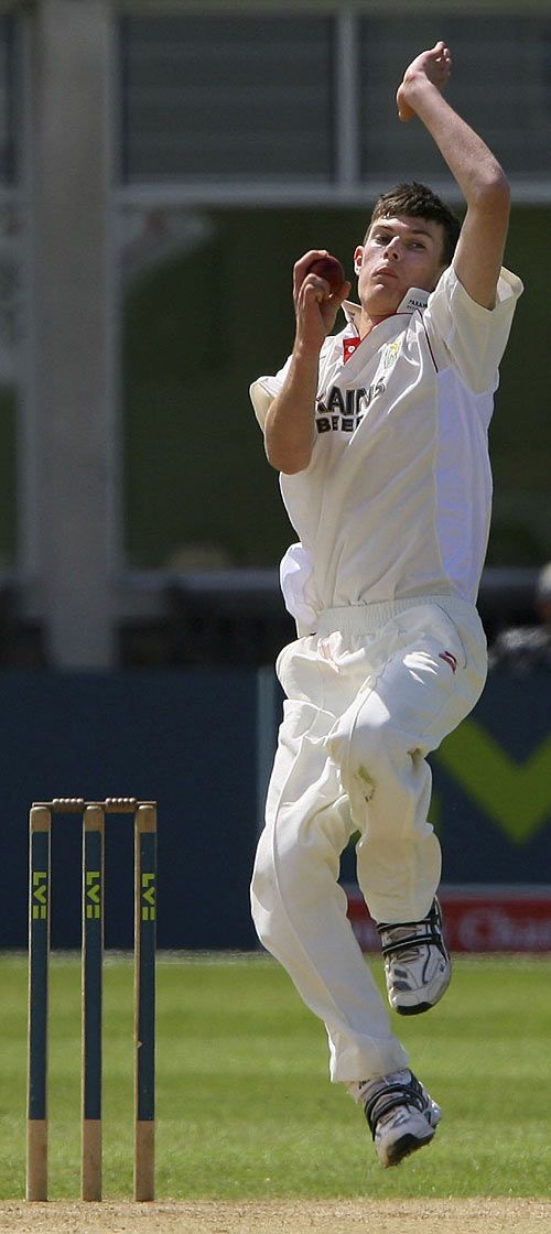 James Harris approaches the crease on the day he became the youngest to take 10 wickets in a match