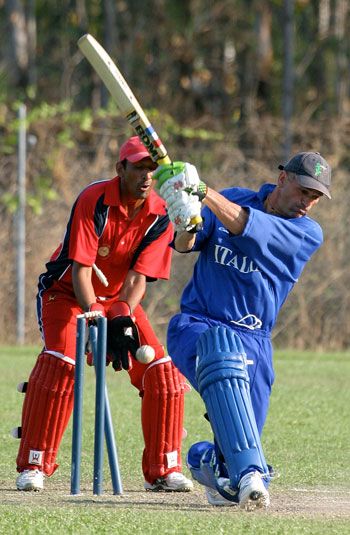 Italy's Troy Crosland is bowled by Najeeb Amar