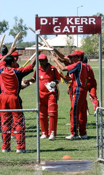 The Hong Kong players give Rahul Sharma a guard of honour after he scored 85 in his last innings against Tanzania