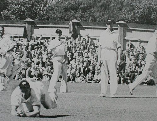 Verdun Scott dives and takes a brilliant diving catch to remove Don Tallon