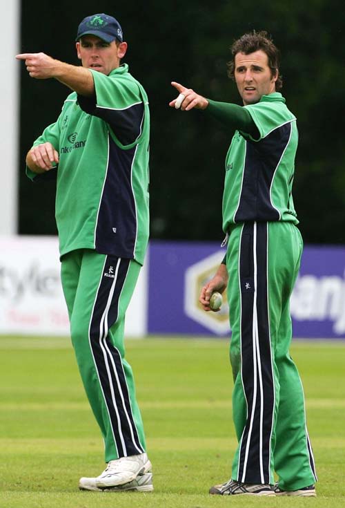 Trent Johnston and Kyle McCallan adjust the field