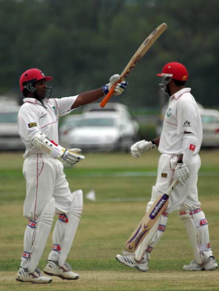 Sunil Dhaniram celebrates his maiden first-class century against UAE