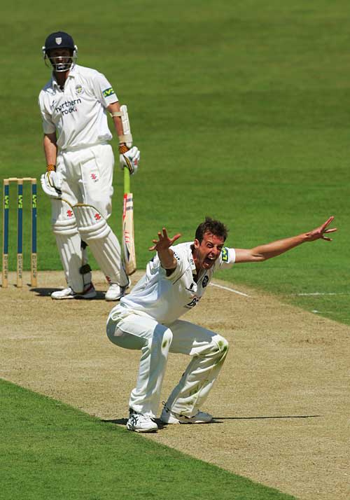 Neil Saker pleads for the wicket of Dale Benkenstein