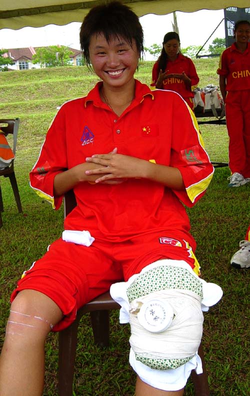 Playing with a strained ligament, Hu Ting Ting added 31 runs with Duan Qiong to take China to a seven-wicket victory over UAE