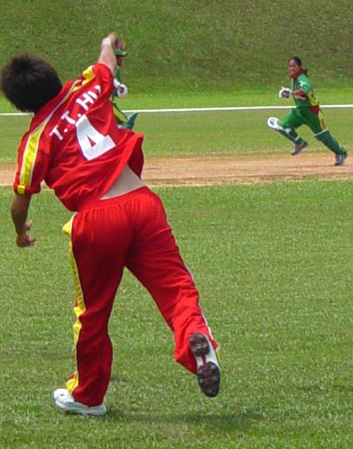 China's Hu Ting Ting attempts to run out Ayesha Akhter