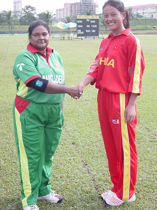 Bangladesh captain Tajkia Akhter and China captain Mei Chin Hua shake hands before their game
