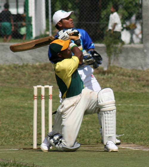 Vanuatuan batsman Andrew Mansale in action against Japan