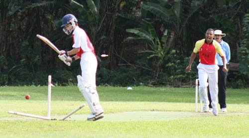 Papua New Guinea fast bowler Loa Nou cleans up a Japanese batsman
