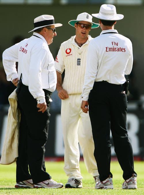 Andrew Strauss, the stand-in captain, talks with Simon Taufel and Ian Howell after a heated incident